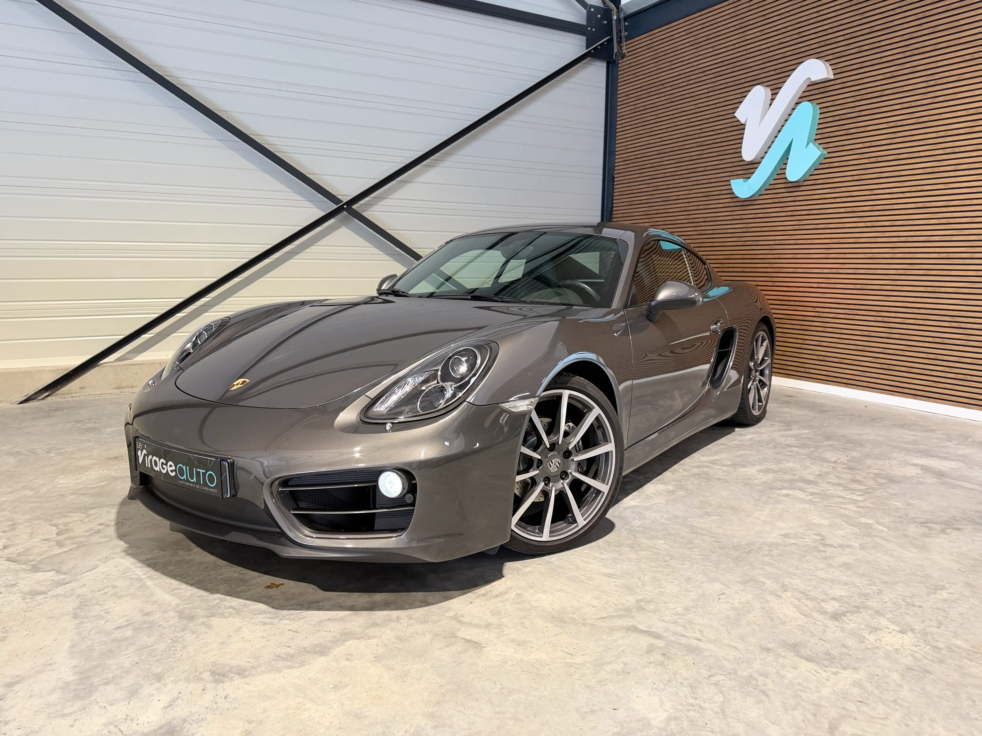 Image principale de Porsche Cayman 981 - 275 cv - PDK - 61000 Km - Siege chauffants - Echappement sport - Interieur Cuir - Xenon